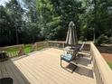 Inviting wooden deck with outdoor seating, perfect for relaxing and entertaining at 328 West Ln, Woodstock, GA 30188