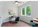 Comfortable home office space with a window providing natural light, accented by a stylish chair and modern art at 415 Gartrell Se St # 15, Atlanta, GA 30312
