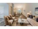 Elegant living room featuring a view into the dining area, hardwood floors, and neutral paint at 482 Tarragon Sw Way, Atlanta, GA 30331