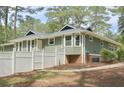 Exterior of this home featuring a nice, fenced yard with an air conditioning unit at 1516 Chase Ct, Riverdale, GA 30296