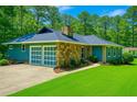 Beautiful, single story home with a two car garage and well-manicured lawn at 1516 Chase Ct, Riverdale, GA 30296