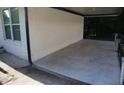 The covered carport features a concrete floor and sturdy columns, offering shade and protection at 3199 Nw Delmar Ln, Atlanta, GA 30311