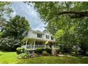 Attractive two-story home featuring a charming front porch, perfect for relaxing and enjoying the outdoors at 4114 Falcon Shores Nw Ct, Acworth, GA 30101