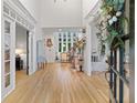 Grand foyer with soaring ceilings, hardwood floors, and an elegant staircase at 2430 Flat Stone Dr, Cumming, GA 30041
