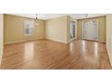 Open living space with hardwood floors, neutral walls, and a view of the front entry at 2667 Hampton Park Dr, Marietta, GA 30062