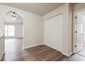 Hallway view showcasing archway, closet, and new floors at 4895 Ozment Ridge Ct, Lithonia, GA 30038