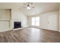 Spacious living room boasting a cozy fireplace and stylish hardwood floors, ideal for relaxation at 4895 Ozment Ridge Ct, Lithonia, GA 30038