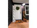 A welcoming front door enhanced by decorative elements, creating an inviting entrance at 124 Dockside Downs Dr, Woodstock, GA 30189