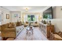 Bright and inviting living room with large window, stylish furniture, and an open, airy layout at 1600 Belle Isle Ne Cir, Atlanta, GA 30329