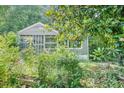 A cozy home nestled amidst verdant trees and shrubbery, offering a private and serene setting at 239 Haas Se Ave, Atlanta, GA 30316