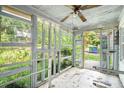 Enclosed sunroom featuring abundant windows providing natural light and views of the outdoors at 239 Haas Se Ave, Atlanta, GA 30316