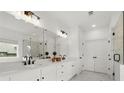 Elegant bathroom featuring double sinks, sleek fixtures, and a glass-enclosed shower at 635 Opera Ln, Alpharetta, GA 30009