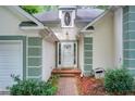 Inviting front entrance with white door, brick walkway, and manicured landscaping at 652 Trailwood Sw Ln, Marietta, GA 30064