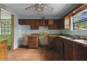 Outdated kitchen with wood cabinets and laminate countertops at 1352 Overlook Se Cv, Smyrna, GA 30080