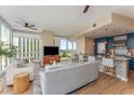 Bright living room featuring floor-to-ceiling windows with city views and open kitchen design at 3325 Piedmont Rd Ne # 1907, Atlanta, GA 30305