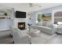 Bright living room with fireplace, built-in shelves, neutral colors, and lots of natural light at 4438 Parmalee Path, Conley, GA 30288