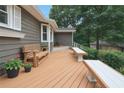Spacious deck with built-in benches and beautiful views perfect for outdoor entertaining at 2655 Nesbit Trl, Alpharetta, GA 30022