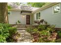 Inviting front entrance with a brick walkway, modern door, and seating area at 2283 Pembrook Ne Pl, Atlanta, GA 30324