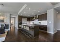 Sleek kitchen with dark wood cabinetry, stainless steel appliances, and a spacious island with seating at 867 Peachtree Ne St # 702, Atlanta, GA 30308