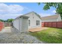 Backyard showing a wooden deck, stone pavers and a fenced yard at 2026 Patterson Park Pl, Lawrenceville, GA 30044