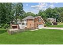 Expansive backyard features a deck, screened porch, and patio area at 742 Maggie Nw Ct, Kennesaw, GA 30144