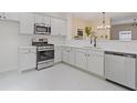 Modern kitchen featuring stainless steel appliances and white cabinetry at 1464 Dolcetto Trce, Kennesaw, GA 30152