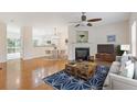 Spacious living room with hardwood floors, fireplace, and ample natural light at 1464 Dolcetto Trce, Kennesaw, GA 30152