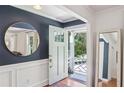 Stylish entryway features fresh white molding, wood floors, and an open doorway at 3120 Mary Dr, Marietta, GA 30066
