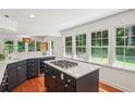 Bright kitchen featuring quartz countertops, center island, and stainless steel appliances at 3120 Mary Dr, Marietta, GA 30066