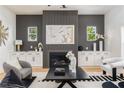 Modern living room with fireplace, built-in cabinets, and contemporary décor at 156 Martha Ne Ave, Atlanta, GA 30317