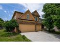 Charming two-story home with a well-manicured lawn and a spacious two-car garage at 4032 Duran Ln, Auburn, GA 30011