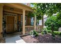 Inviting front porch with decorative plants and a welcome sign creates a warm and welcoming entrance at 4032 Duran Ln, Auburn, GA 30011