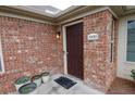 Close-up of the front door, showcasing brick exterior and attractive entryway at 1000 Silver Summit Se Dr, Conyers, GA 30094