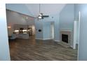 Open-concept living room with fireplace and view of the modern kitchen at 1000 Silver Summit Se Dr, Conyers, GA 30094