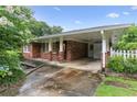 Charming single-story home with a brick facade and a covered carport at 2711 Fairlane Dr, Atlanta, GA 30340