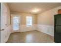 Inviting dining area with neutral walls, chair rail detail, and access to backyard at 2850 Vining Ridge Ter, Decatur, GA 30034