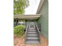 Inviting entrance with stairs leading to the front door, complemented by green siding at 49 Patty Dr, Dallas, GA 30157