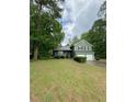 Two-story home featuring a two-car garage and well-manicured front yard at 49 Patty Dr, Dallas, GA 30157