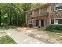 Charming townhouse featuring brick and stone accents, complemented by mature landscaping and a welcoming entrance at 100 Biscayne Nw Dr # C1, Atlanta, GA 30309