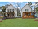 Two stylish two-story homes featuring inviting front porches and landscaped front yards create curb appeal at 826 Gaston Sw St, Atlanta, GA 30310