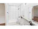Updated bathroom featuring double sinks, granite countertop, subway tile, and contemporary mirrors at 2203 Second Ave, Decatur, GA 30032