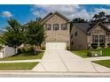 Inviting two-story home with a brick facade and a well-maintained front yard at 565 Lance View Ln, Lawrenceville, GA 30045