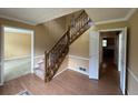 Inviting foyer features hardwood floors, wooden staircase, and natural light at 25 Darcee Ct, Lawrenceville, GA 30046