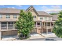 Exterior view of townhomes with garages and covered balconies, showcasing the neighborhood's charming architecture at 406 Mareeba Park # 61, Canton, GA 30114