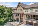 Townhome exteriors with attached garages and upper-level covered balconies, perfect for relaxing outdoors at 406 Mareeba Park # 61, Canton, GA 30114
