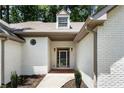 Front entrance of a house with a beautiful brick walkway and updated facade at 251 Waller Nw Cir, Marietta, GA 30064
