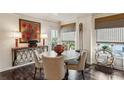 Cozy dining room featuring a round table, designer chairs and stylish window treatments at 275 13Th Ne St # 201, Atlanta, GA 30309