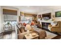 Inviting living room featuring a cozy fireplace, stylish furnishings, and an abundance of natural light at 275 13Th Ne St # 201, Atlanta, GA 30309