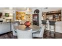 Open living area features a dining table, comfortable seating and a modern kitchen at 275 13Th Ne St # 201, Atlanta, GA 30309
