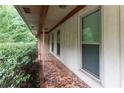 Inviting covered walkway with mosaic tile flooring and bright windows at 4714 Darlene Way, Tucker, GA 30084